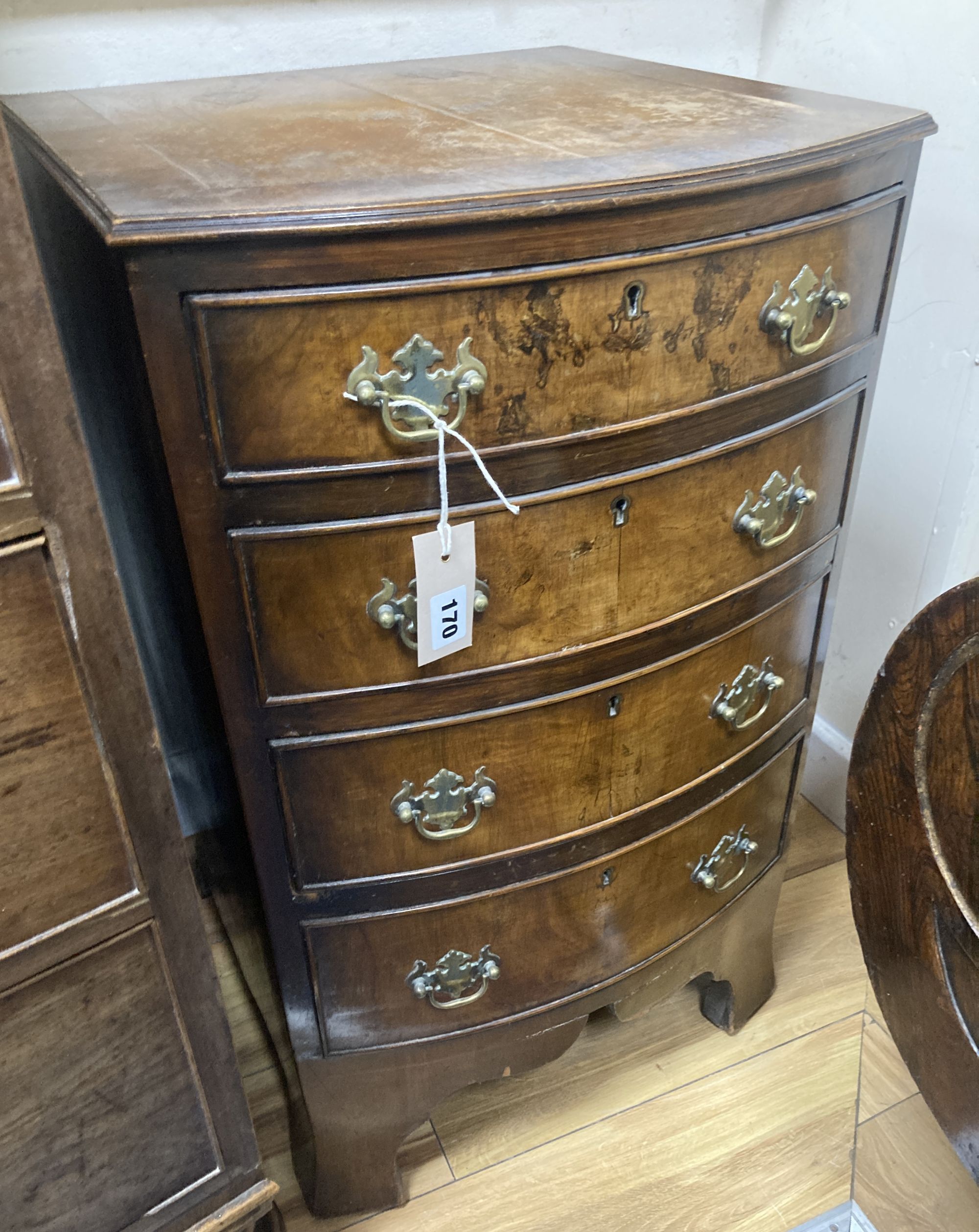 A small Queen Anne style walnut bow-fronted chest of drawers, width 44cm, depth 44cm, height 74cm